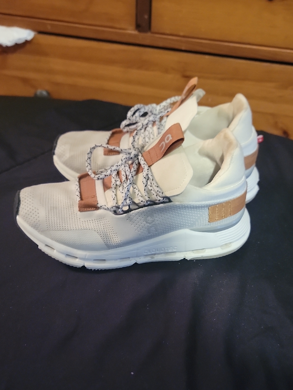 On Running White and Tan Athletic Sneakers